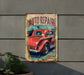 an old rusty auto repair sign hanging on a wall