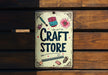 a sign that says craft store hanging on a wooden wall