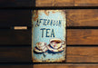 a sign that says afternoon tea on it