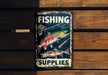 a fishing sign hanging on a wooden wall