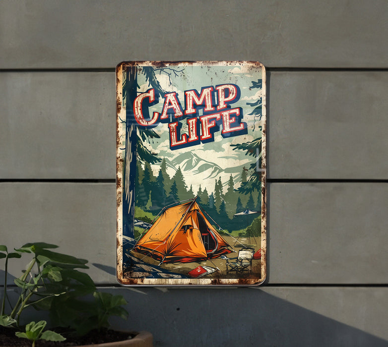 a metal sign that says camp life hanging on the side of a building