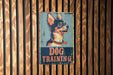 a dog training sign on a wooden wall