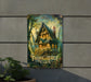 a painting of a fairy tale cabin hangs on a wall