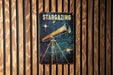 a poster of a telescope on a wooden wall