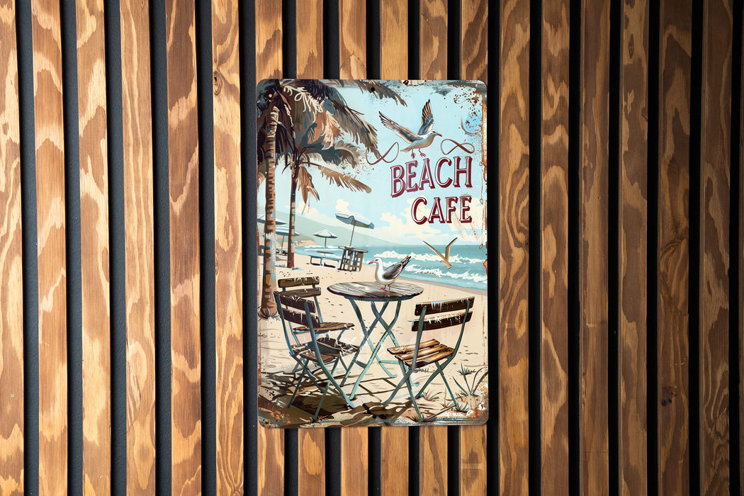a picture of a beach cafe sign hanging on a wall