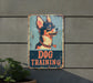 a dog training sign on the side of a building