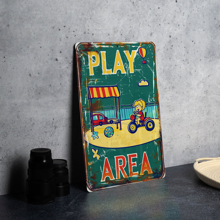 a play area sign sitting on top of a table