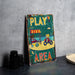 a play area sign sitting on top of a table