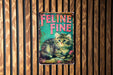 a metal sign with a kitten on it