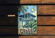 a can of cabana on a wooden bench