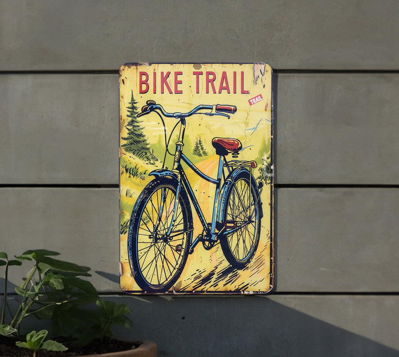 a bicycle trail sign on the side of a building