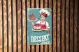 a sign that says dessert chef on a wooden wall