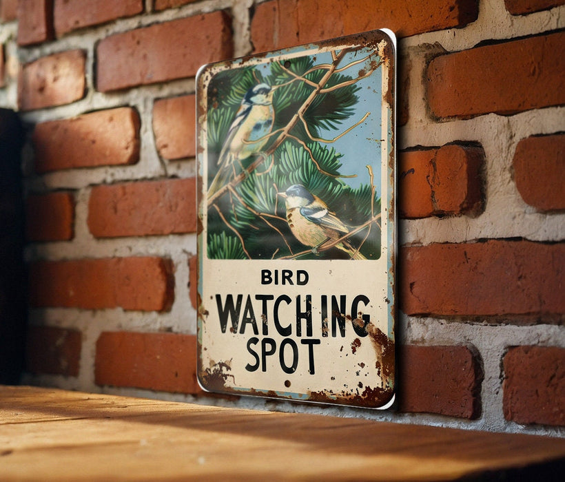 a bird watching spot sign on a brick wall