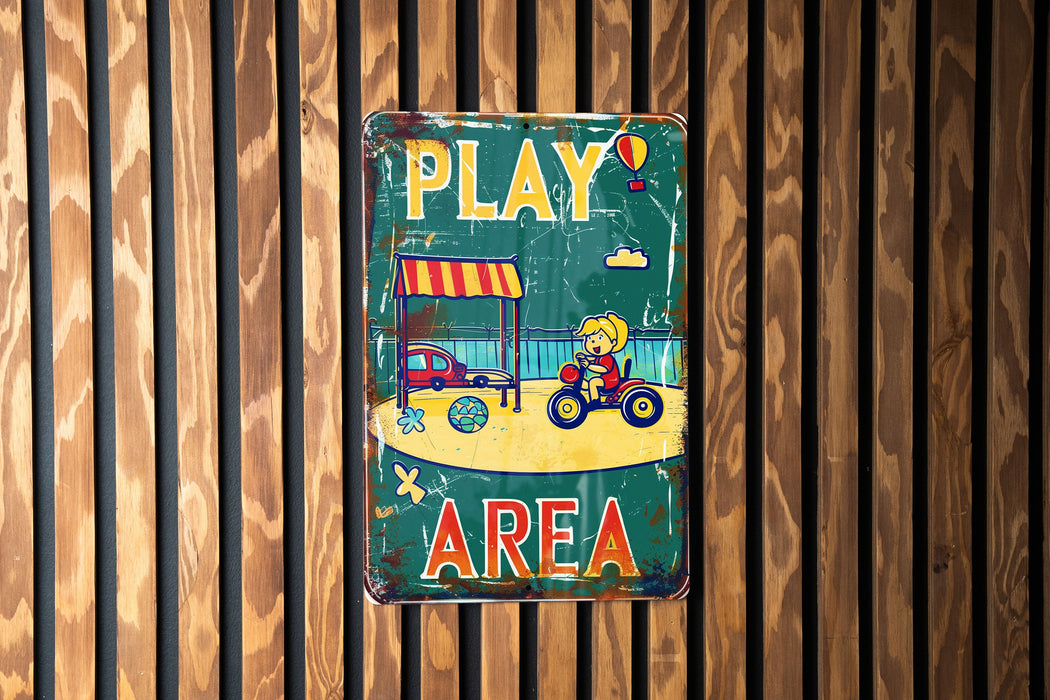a sign on a wooden wall that says play area