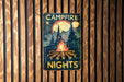 a campfire sign hanging on a wooden wall
