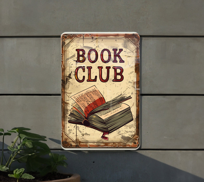 a book club sign hanging on the side of a building