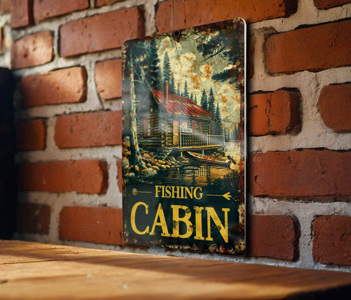 a picture of a fishing cabin hanging on a brick wall