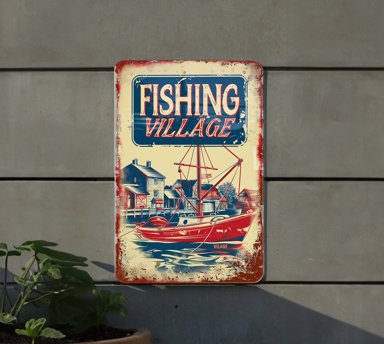 a fishing village sign hanging on the side of a building