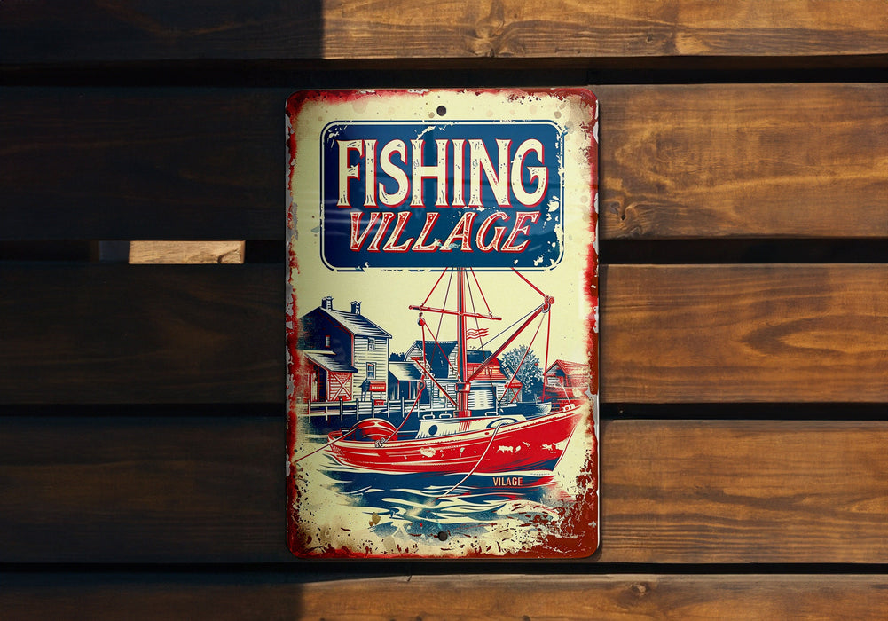 a fishing village sign hanging on a wooden wall