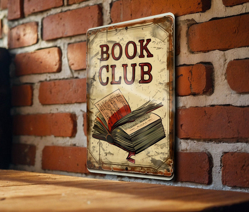 a book club sign hanging on a brick wall