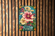 a painting of a flower on a wooden wall