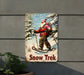 a snow trek sign hanging on a wall