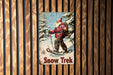 a picture of a man on skis on a wooden wall