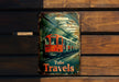 a sign on a wooden wall that says tube travels