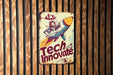 a sign on the side of a building that says tech innovate