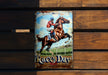 a metal sign with a horse and jockey on it