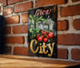 a sign on a brick wall that says grow city