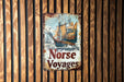 a sign on a wooden wall that says norse voyages