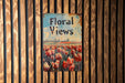 a sign on a wooden fence that says floral views