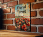 a sign on a brick wall that says floral views