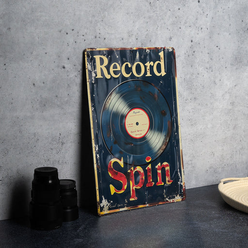 a record sitting on top of a table next to a plate
