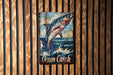 a picture of a fish on a wooden wall
