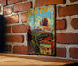 a picture of a red rock sign on a brick wall