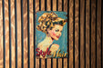 a picture of a woman's hair on a wooden wall