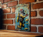 a painting of a diver on a brick wall