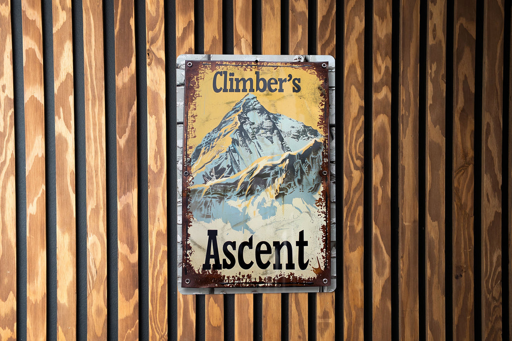 a sign on a wooden wall that reads climbr's ascent