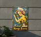 a metal sign that says keep bees on it