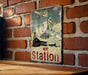 a sign on a brick wall that says ice station