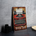 a sign with an old fashioned typewriter on it
