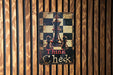 a wooden wall with a sign that says think check