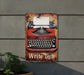 a sign with an old fashioned typewriter on it