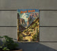 a poster of a desert stretch hanging on the side of a building