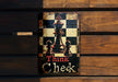 a metal sign that says think check on it