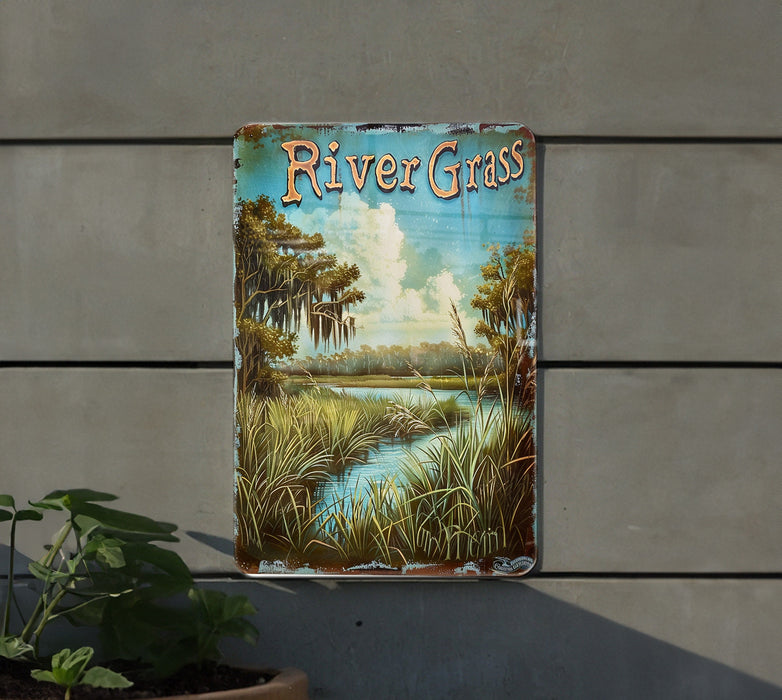 a river grass sign hanging on the side of a building