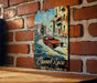 a painting of a boat on a brick wall