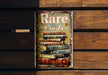 a metal sign that says rare finds on it